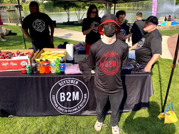 The Boys2Men tent at a community event.