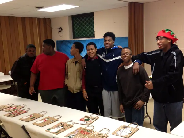 Boys and mentors together at a holiday night.