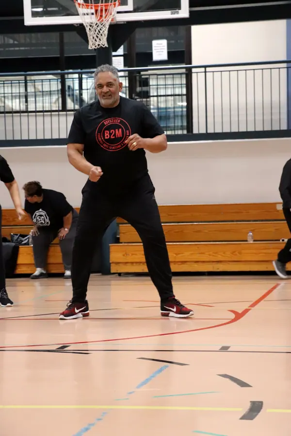 A boy in a gym during a Boys2Men night.